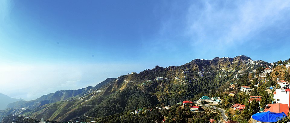 A scenic view of the lush green hills and town of Mussoorie, the Queen of Hills in Uttarakhand.