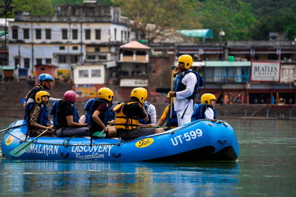 People enjoying river rafting in the Ganges at Rishikesh, the adventure capital of Uttarakhand.