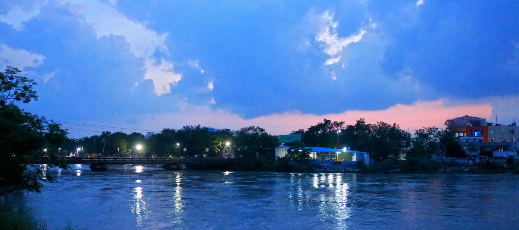 Priests performing the evening Ganga Aarti with large brass lamps at Har Ki Pauri ghat in Haridwar.