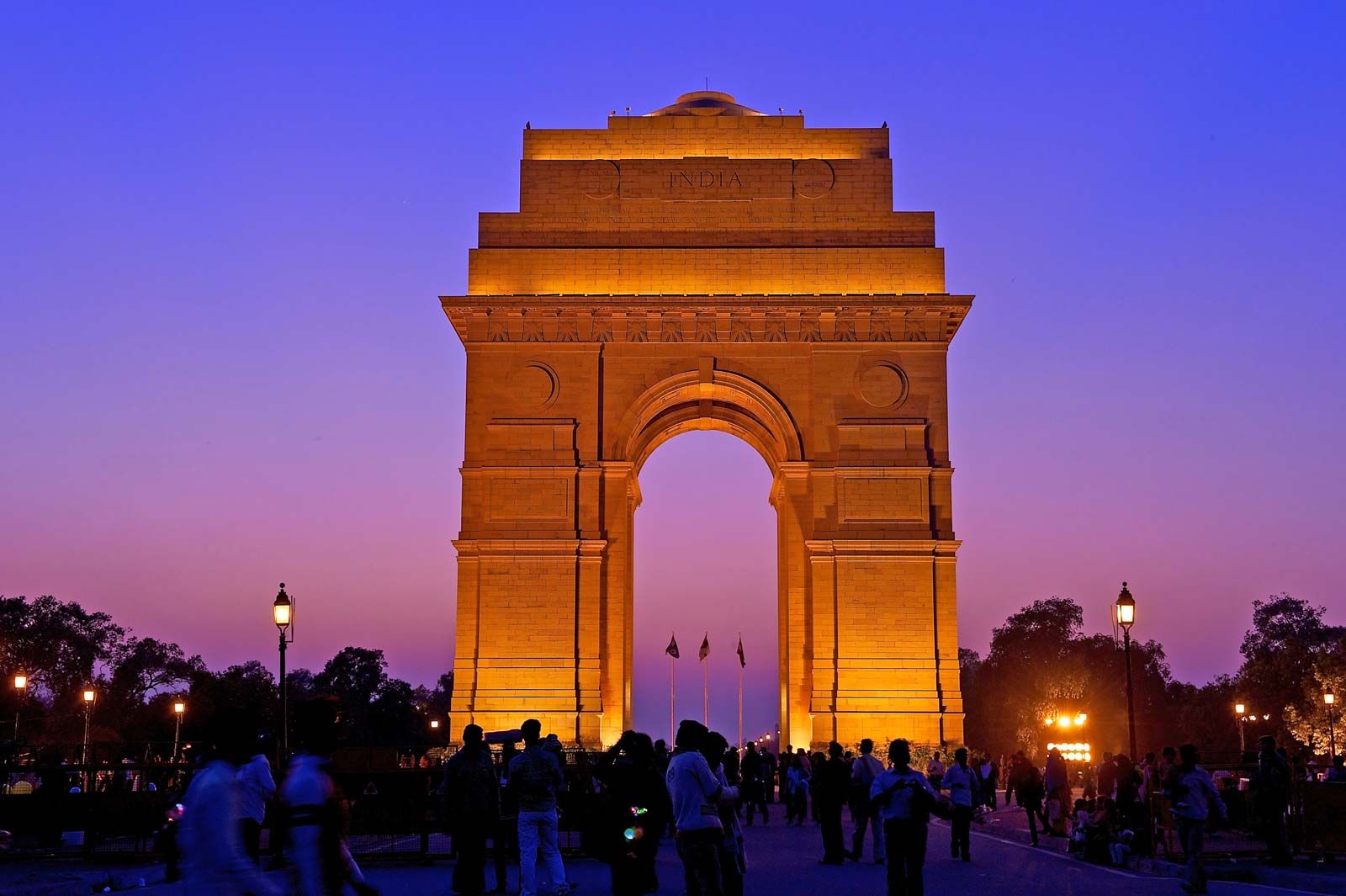 illuminated India Gate war memorial in New Delhi at sunset, a primary stop on the Delhi-Agra heritage tour by Kairos Roam.